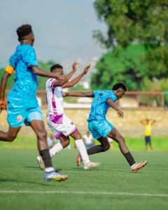 Football players challenging for the ball during a match