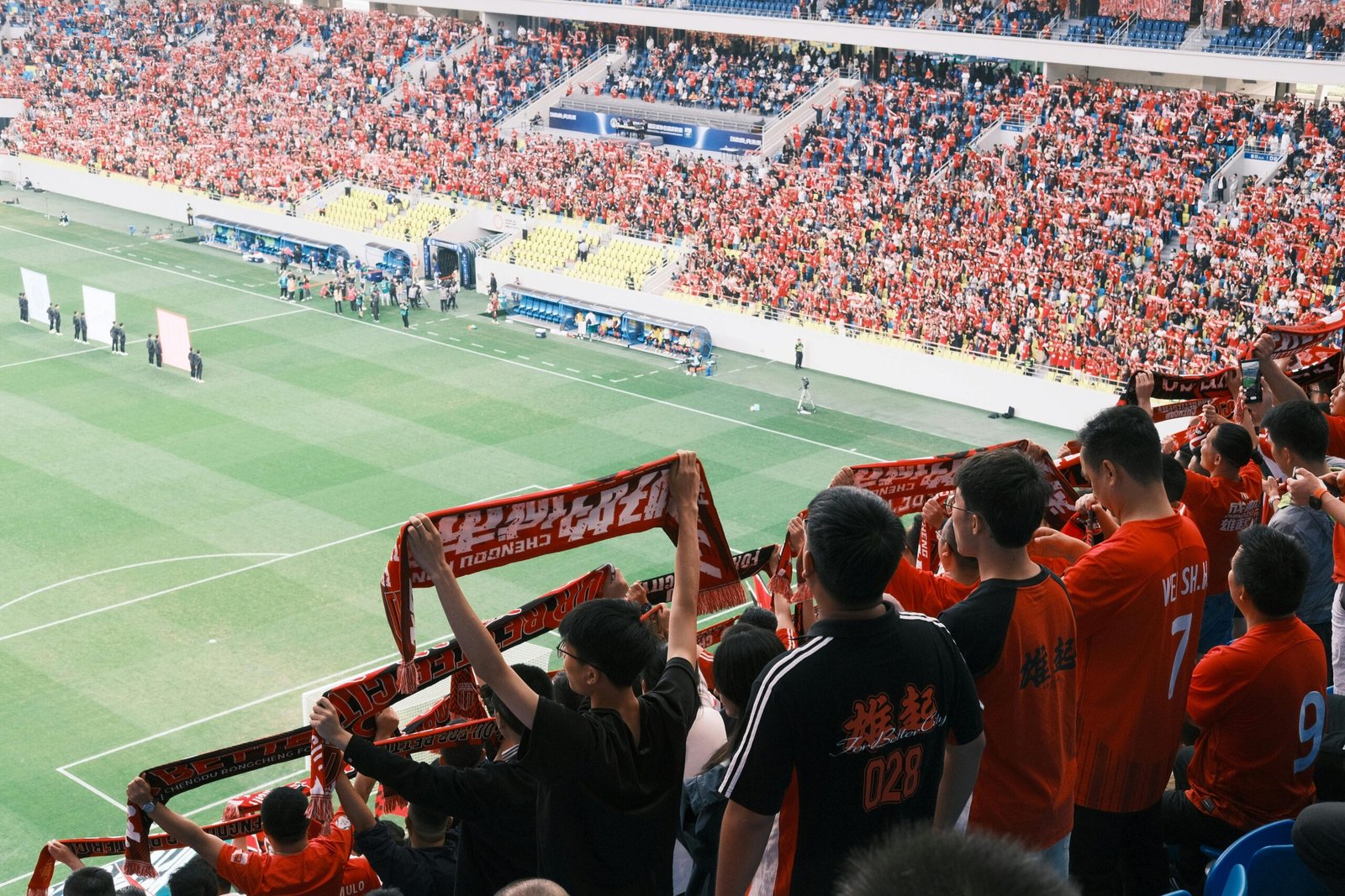 Fans watching a soccer match from the stands